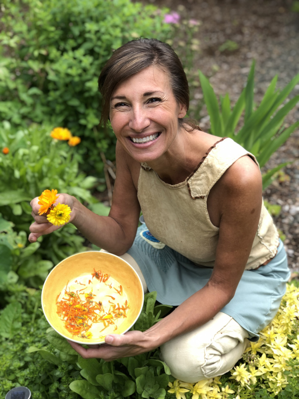 Nicole Apelian harvesting calendula flowers Nicole Apelian harvesting calendula flowers