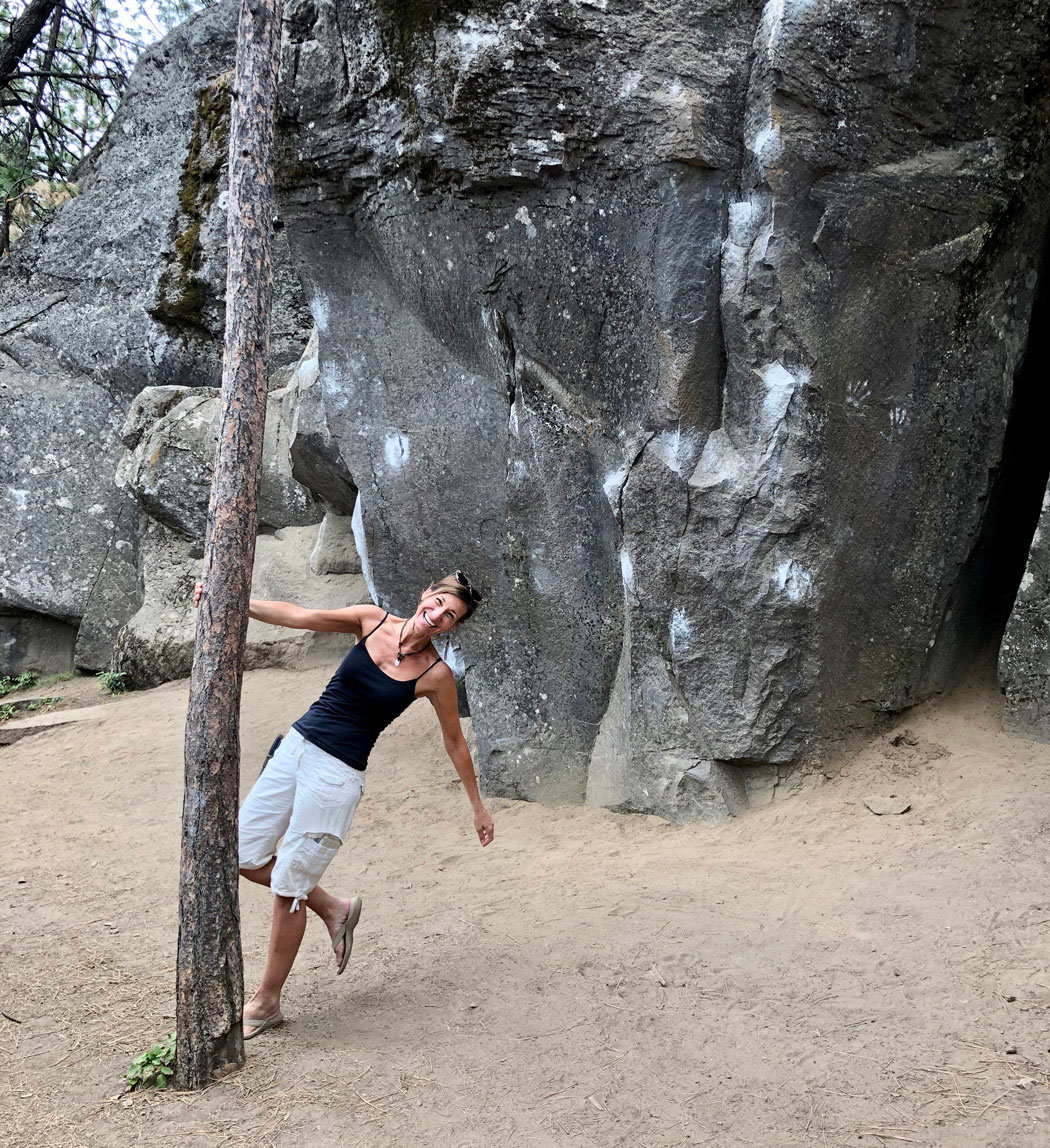 Joyful Nicole Apelian swinging around tree trunk Joyful Nicole Apelian swinging around tree trunk