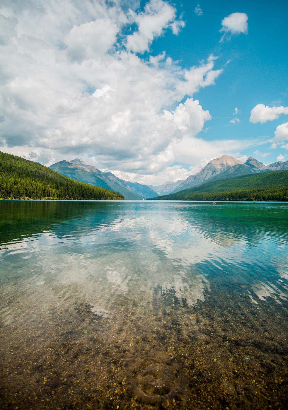 reflective lake with mountains in background reflective lake with mountains in background