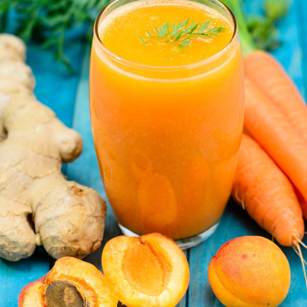 fresh juice with carrot parsley apricot and ginger fresh juice with carrot parsley apricot and ginger