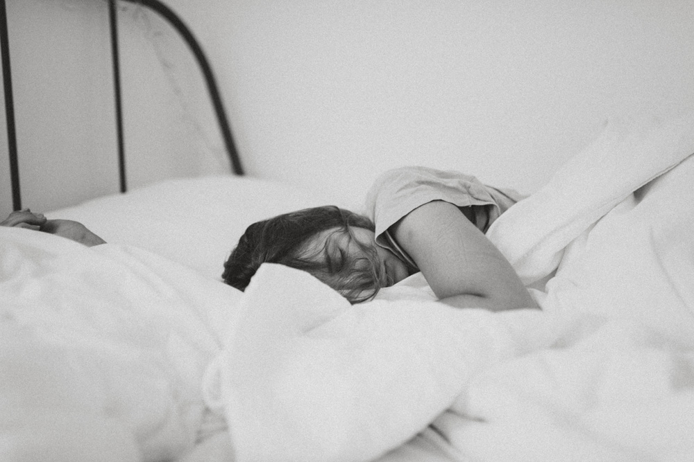 woman sleeping in bed chronic fatigue syndrome woman sleeping in bed chronic fatigue syndrome