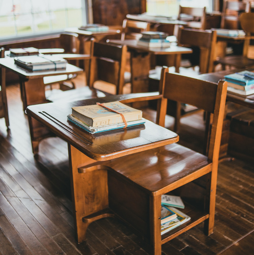classroom with desks and books classroom with desks and books