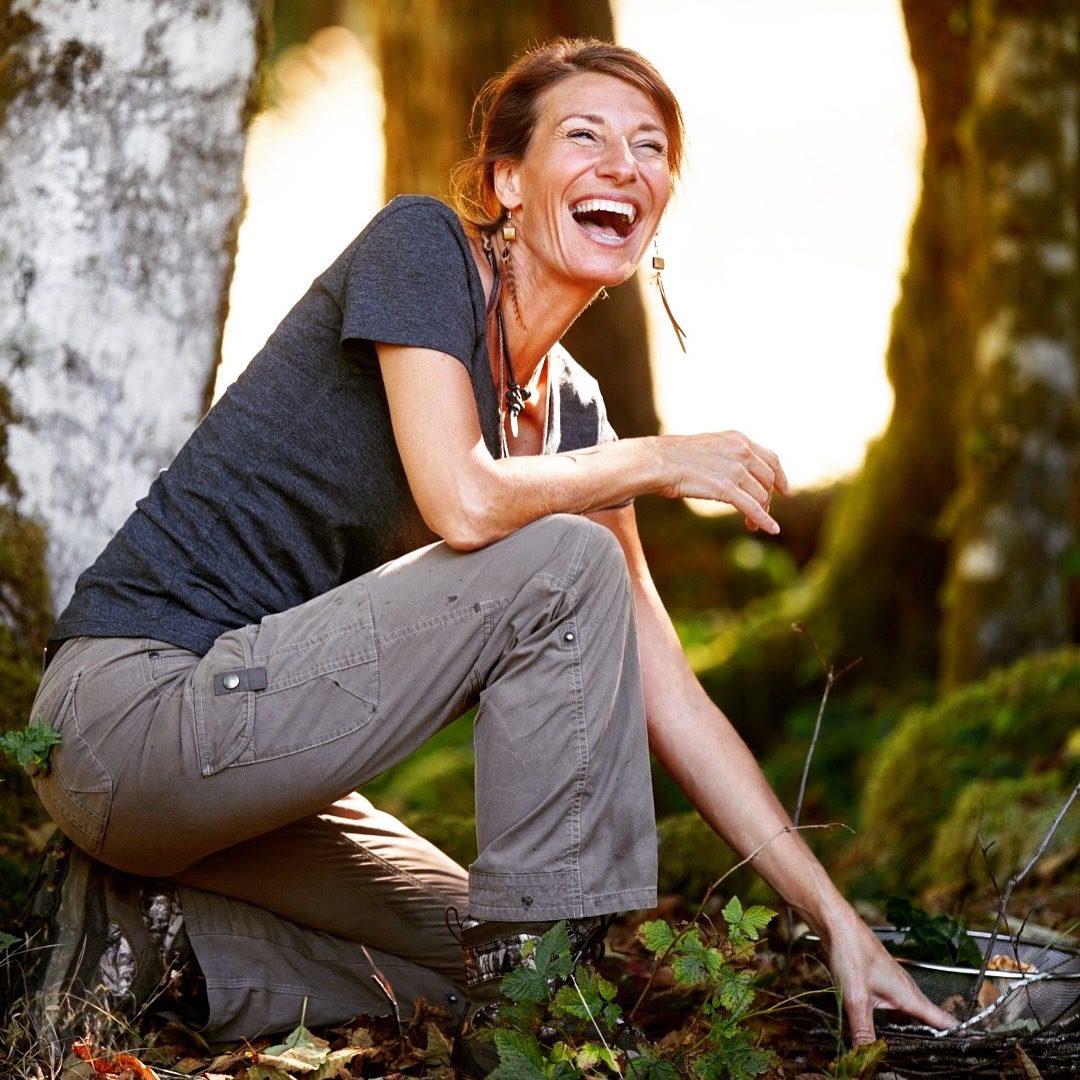 Nicole Apelian laughing in the woods enjoying nature https://nicoleapelian.com/