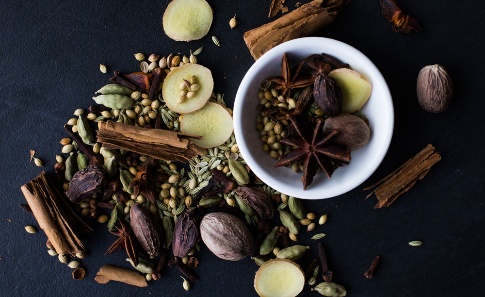 assortment of warming spices clove cinnamon ginger cardamom assortment of warming spices clove cinnamon ginger cardamom