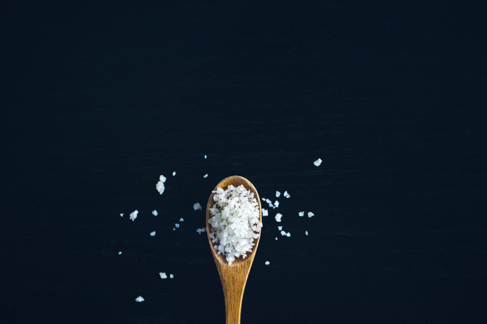 wooden spoon with coarse salt wooden spoon with coarse salt