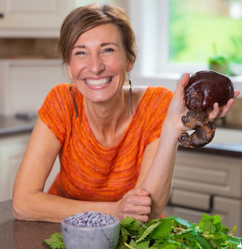 Nicole Apelian holding Reishi mushroom in kitchen Nicole Apelian holding Reishi mushroom in kitchen