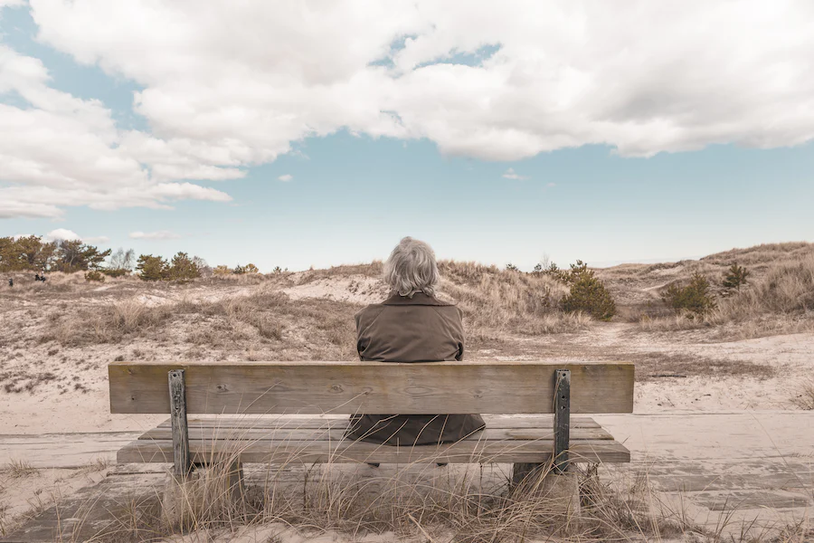 person sitting alone on bench person sitting alone on bench
