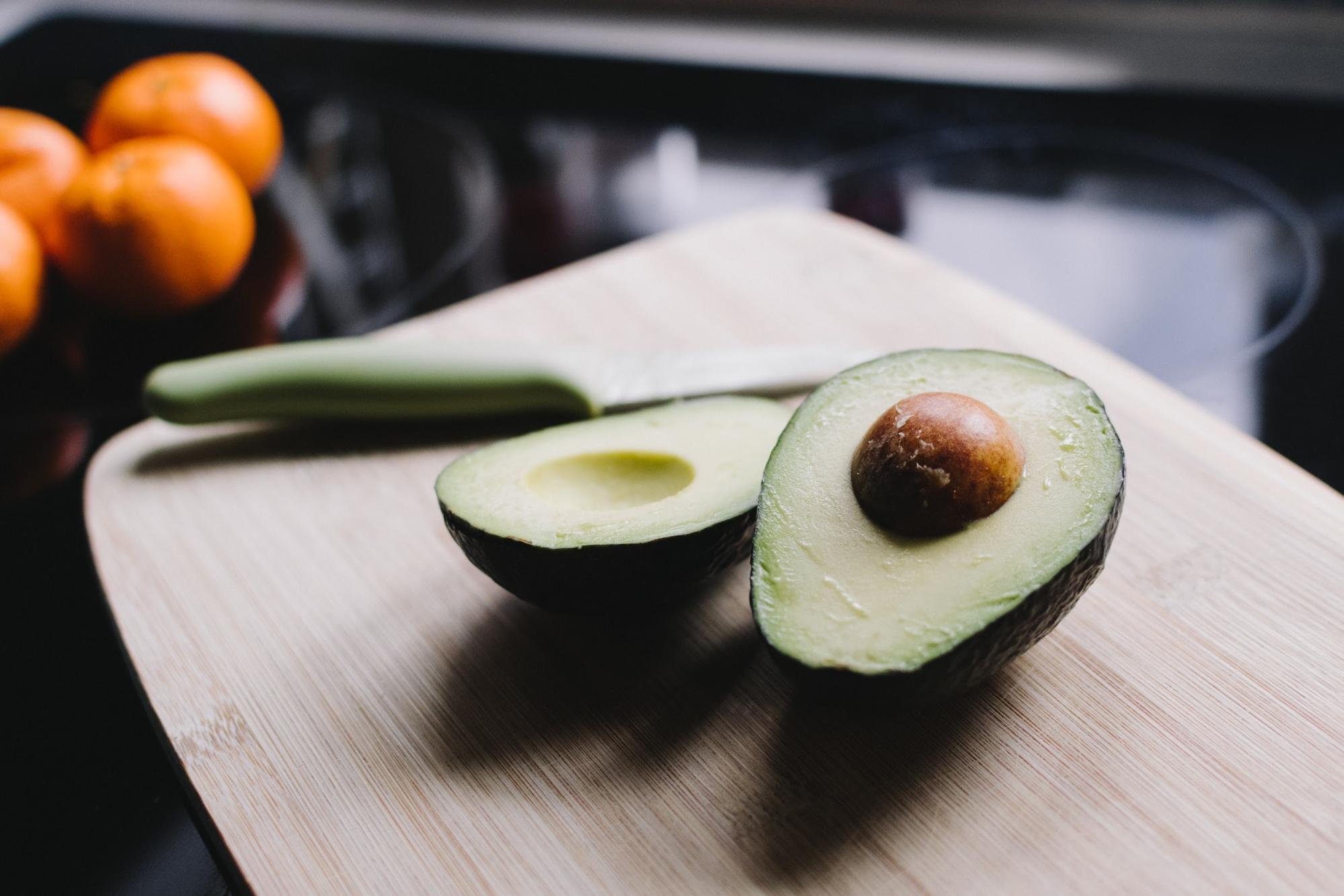 Nicoles Apothecary Bronchial Blend tincture avocado sliced in half on a cutting board