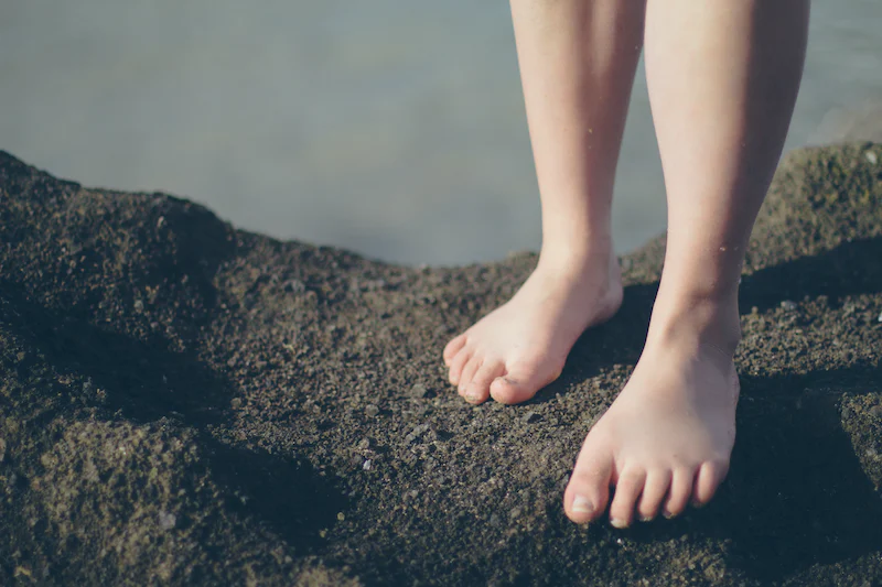 bare feet standing in dirt bare feet standing in dirt