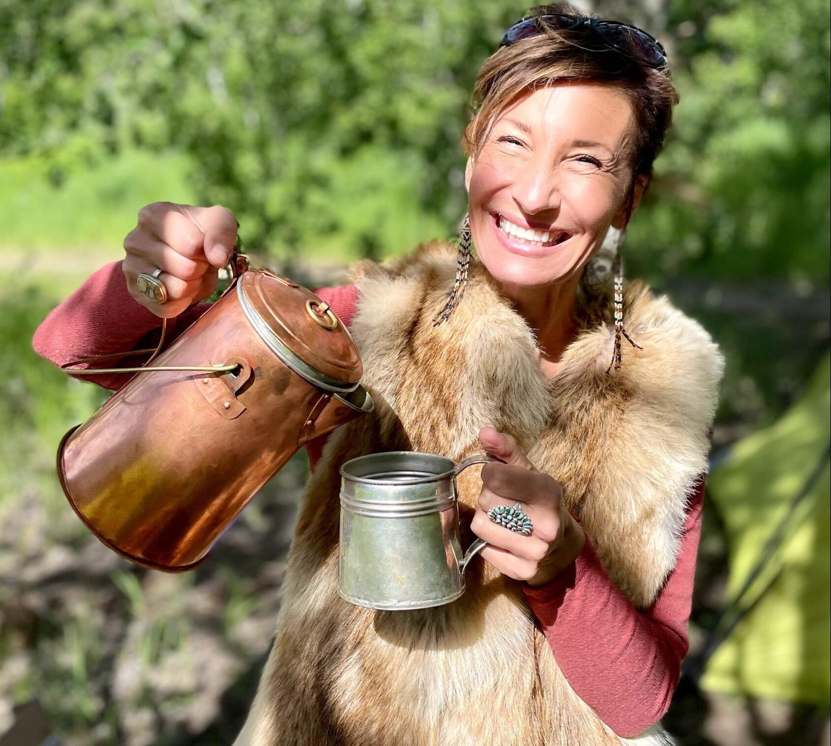 Nicole Apelian pouring from a kettle outdoors Non-Dairy Chai Tea: A Delicious Way to Fight Inflammation, Pain, & Much More — Recipe Included!