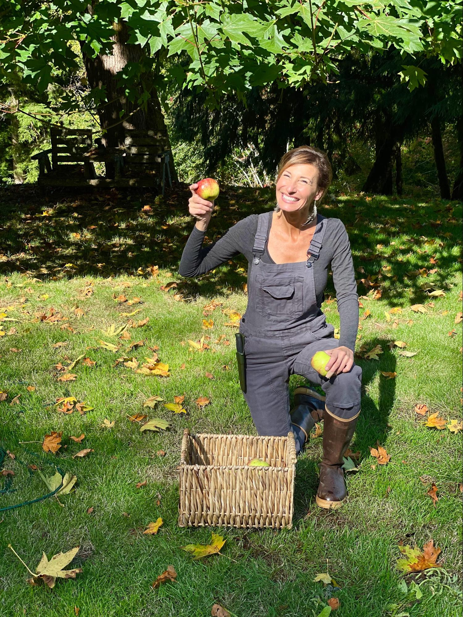 Nicole Apelian holding fresh picked apple