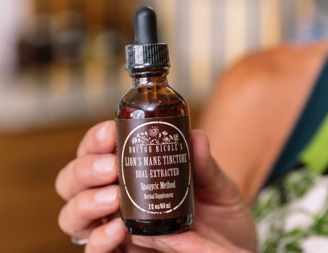 Nicole Apelian holding her Dual-Extracted Lions Mane Tincture Nicole Apelian holding her Dual-Extracted Lions Mane Tincture