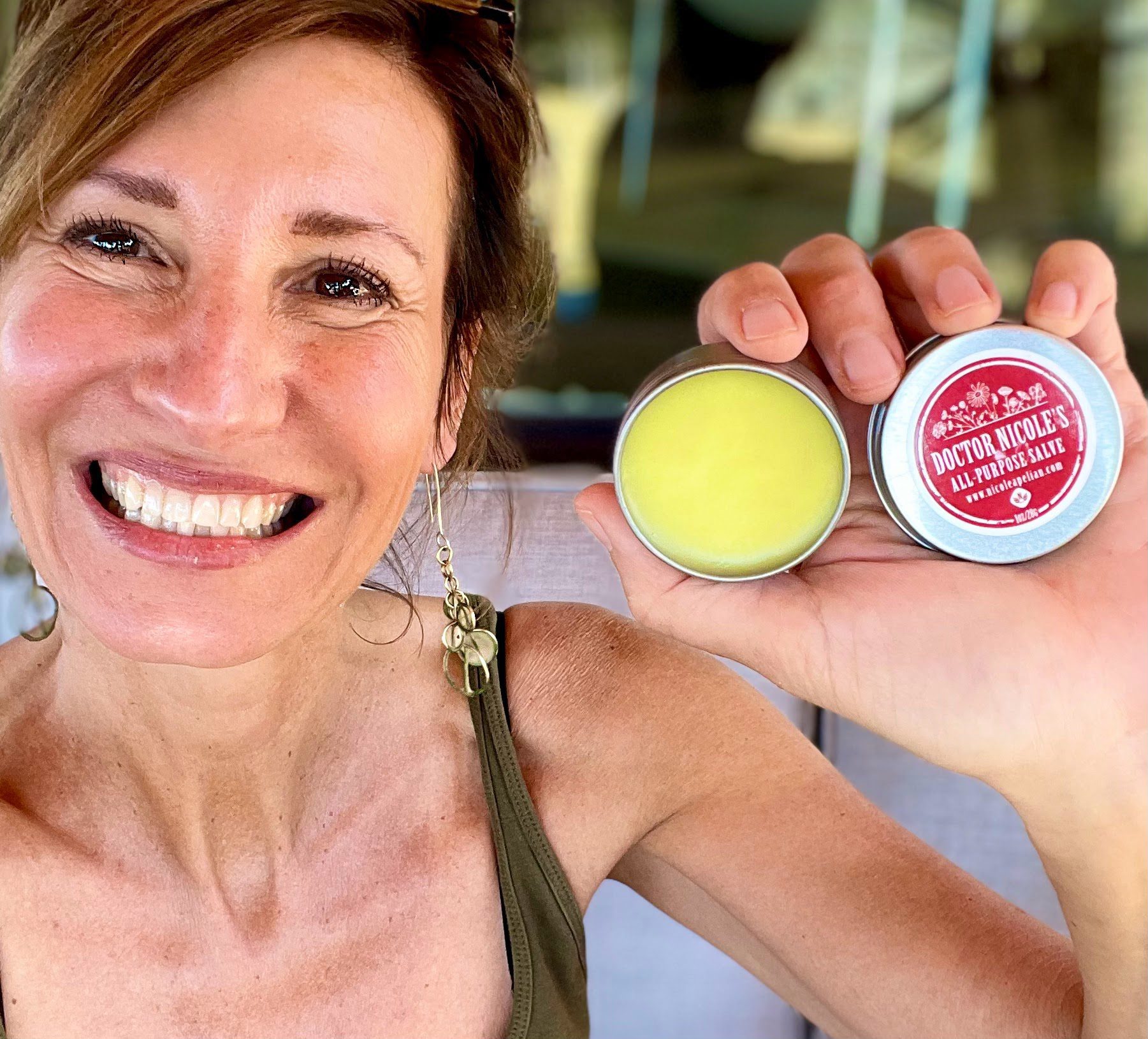 Nicole Apelian holding her All Purpose First Aid Salve