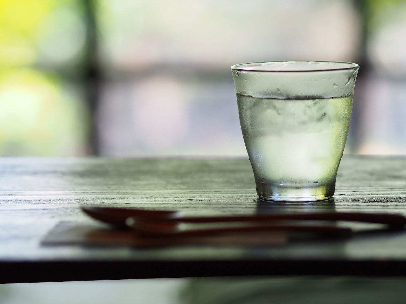 glass of cool water on a table glass of cool water on a table
