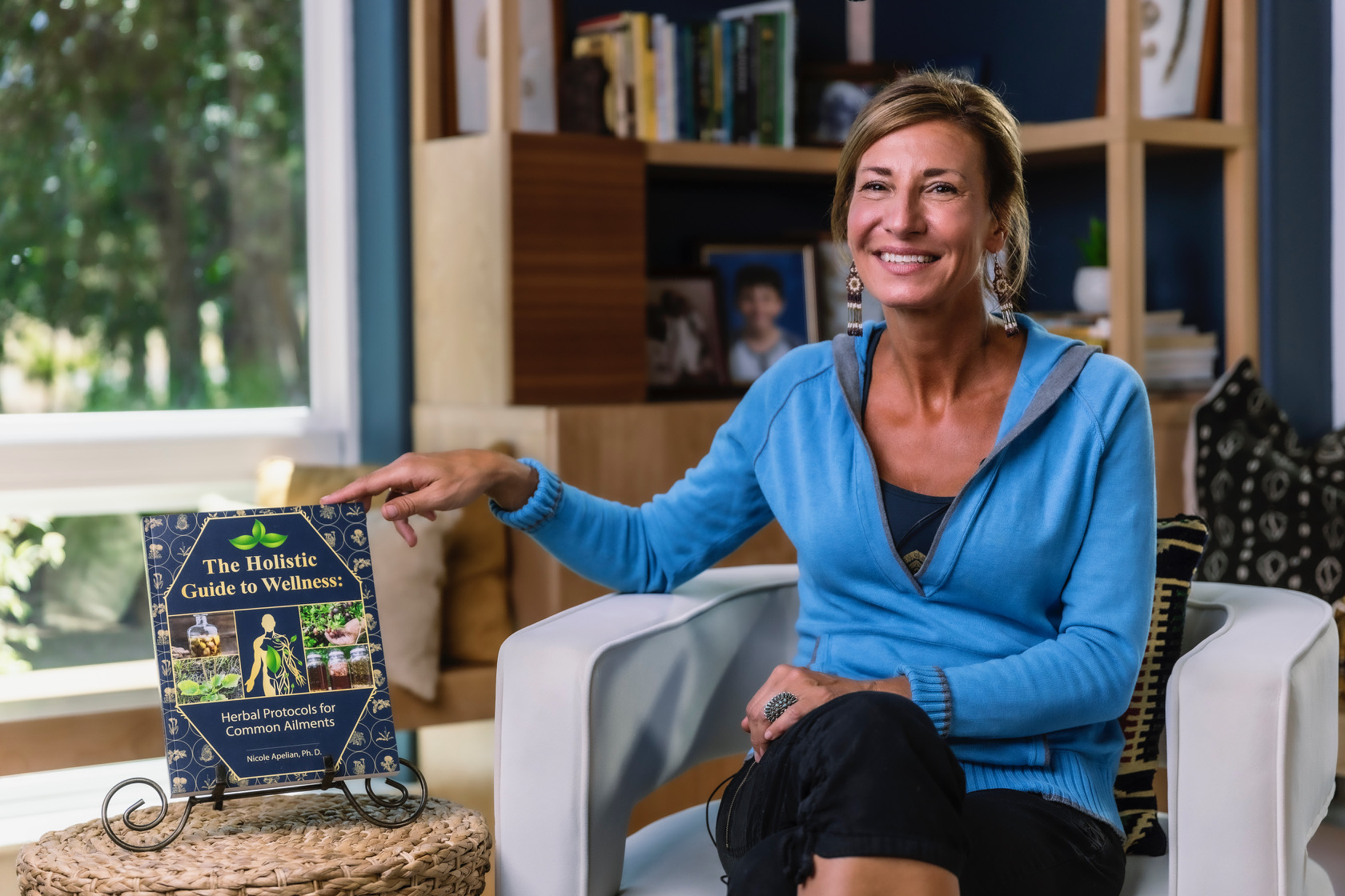 Nicole Apelian and her The Holistic Guide to Wellness book