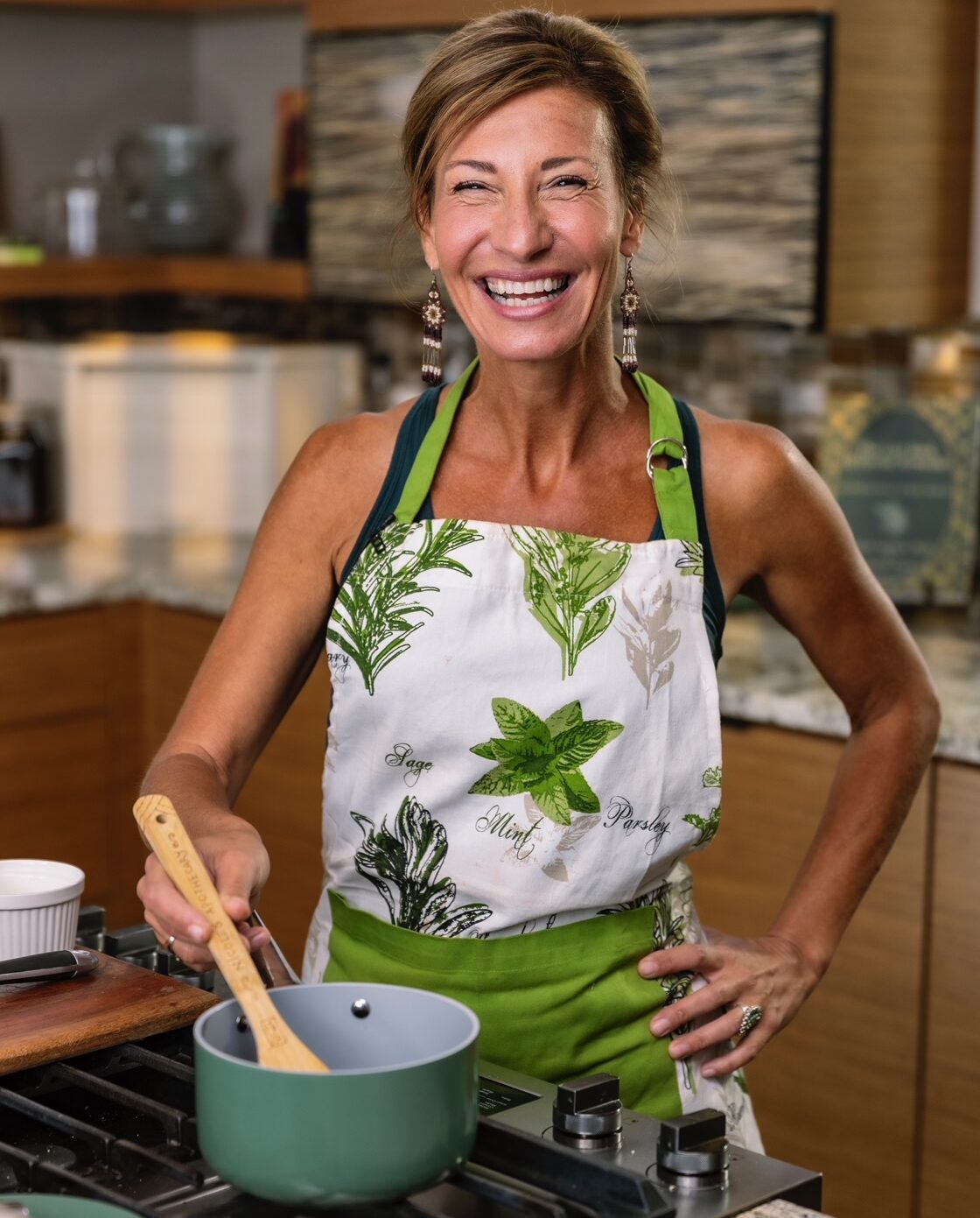 Nicole Apelian stirring pot in kitchen Nicole Apelian stirring pot in kitchen