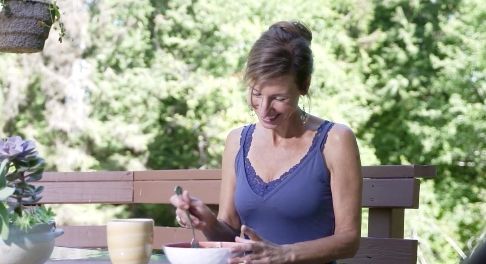 Nicole Apelian outside eating on deck Nicole Apelian outside eating on deck