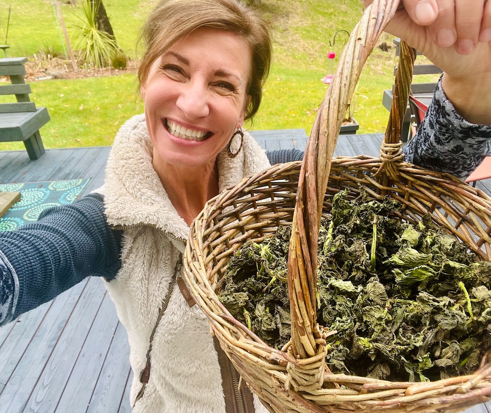 Nicole Apelian with basket of dried stinging nettle