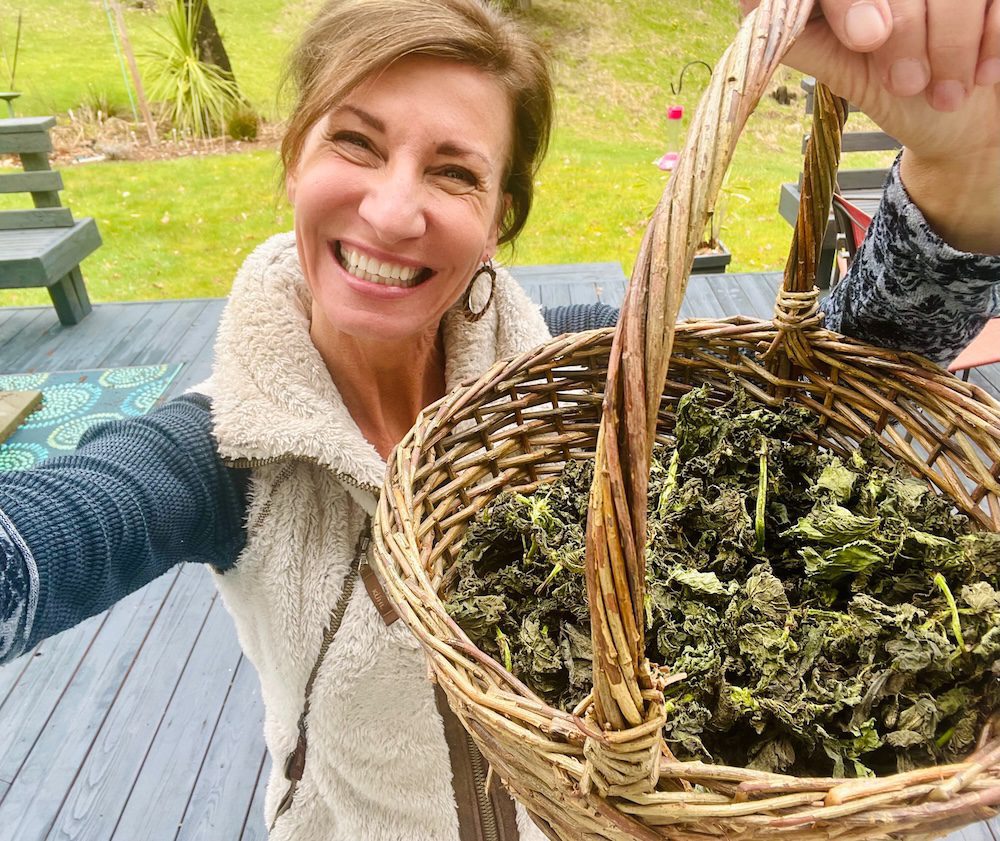 Nicole Apelian with basket of dried stinging nettle