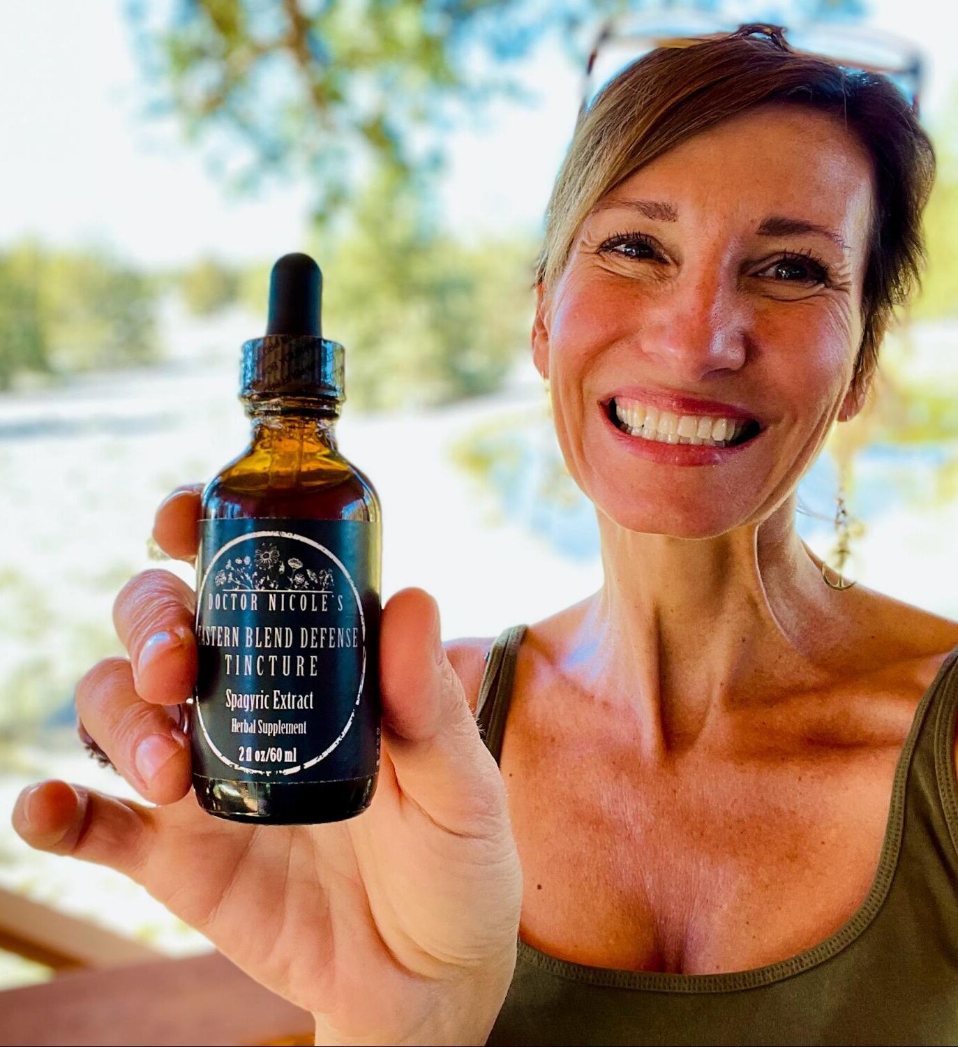 Nicole Apelian holding Eastern Blend Defense Tincture