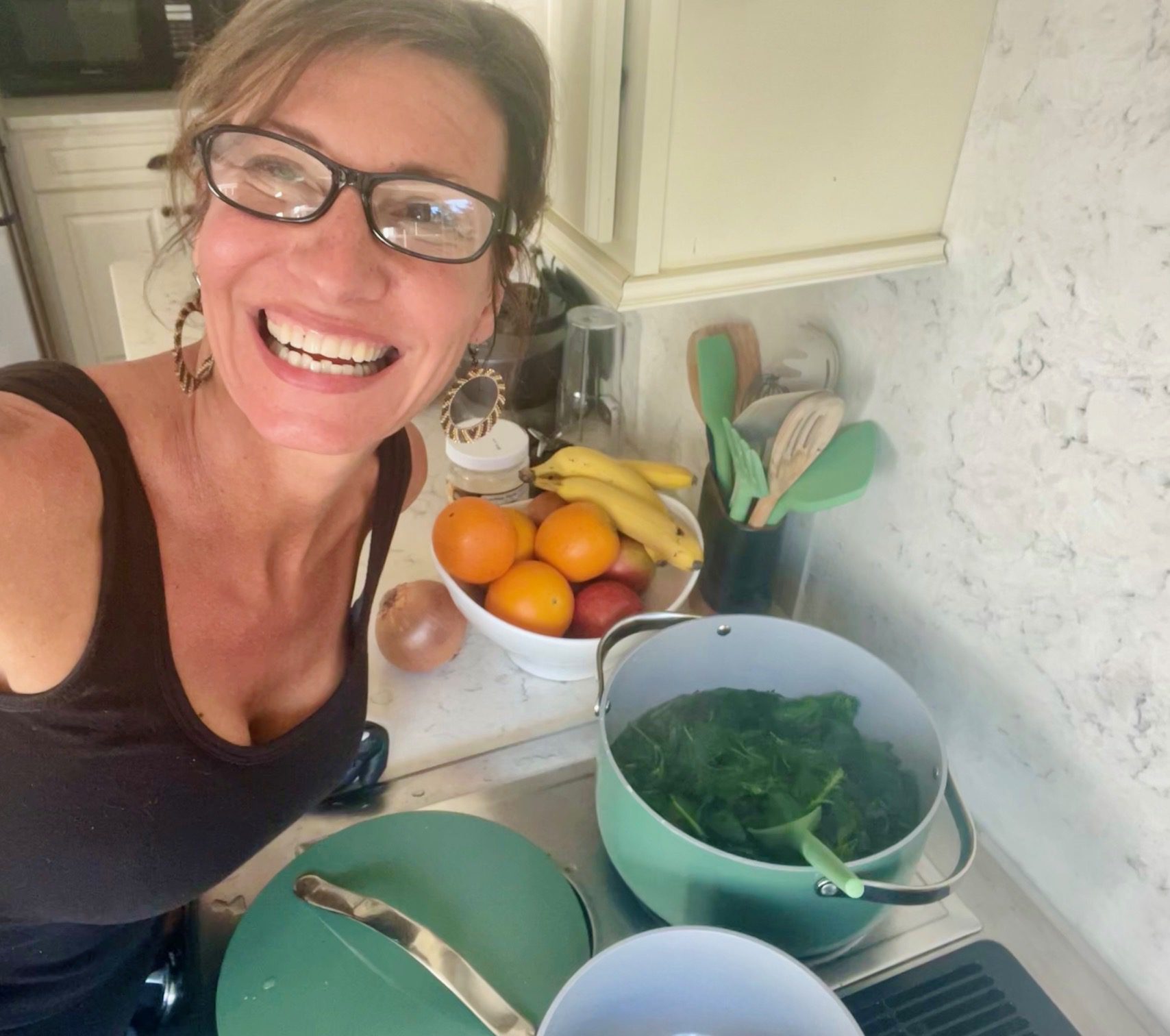 Nicole Apelian cooking with Caraway cookware Hiding in Plain Sight: Top Alternatives to Toxic Cookware