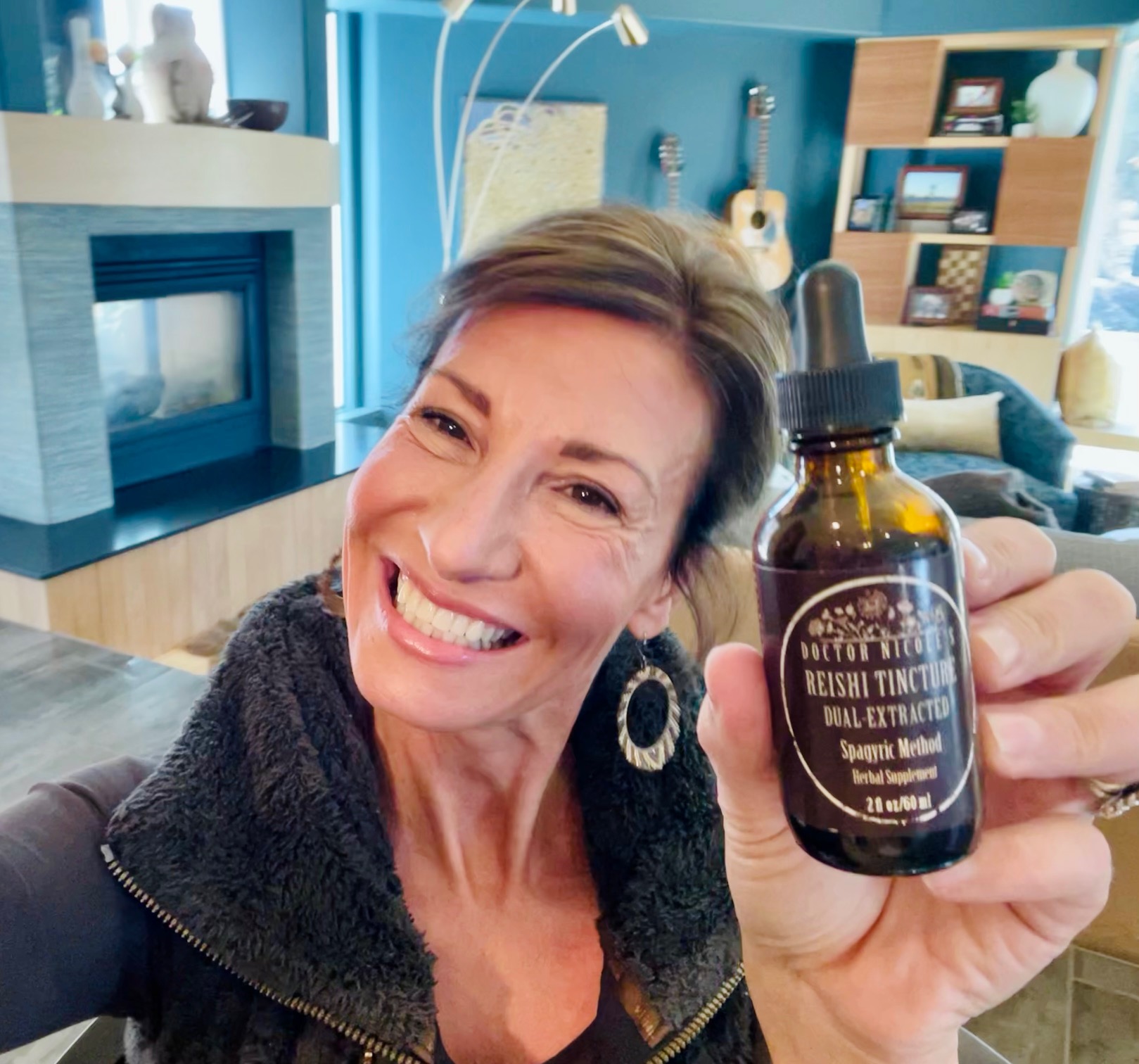 Nicole Apelian holding Reishi Tincture
