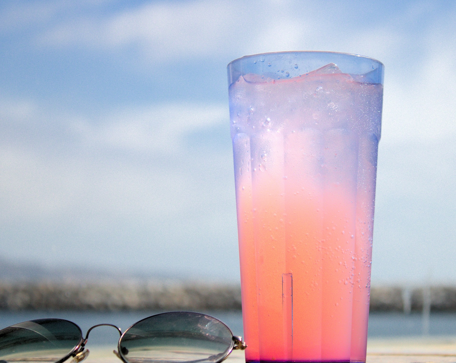 refreshing pink drink and sunglasses refreshing pink drink and sunglasses