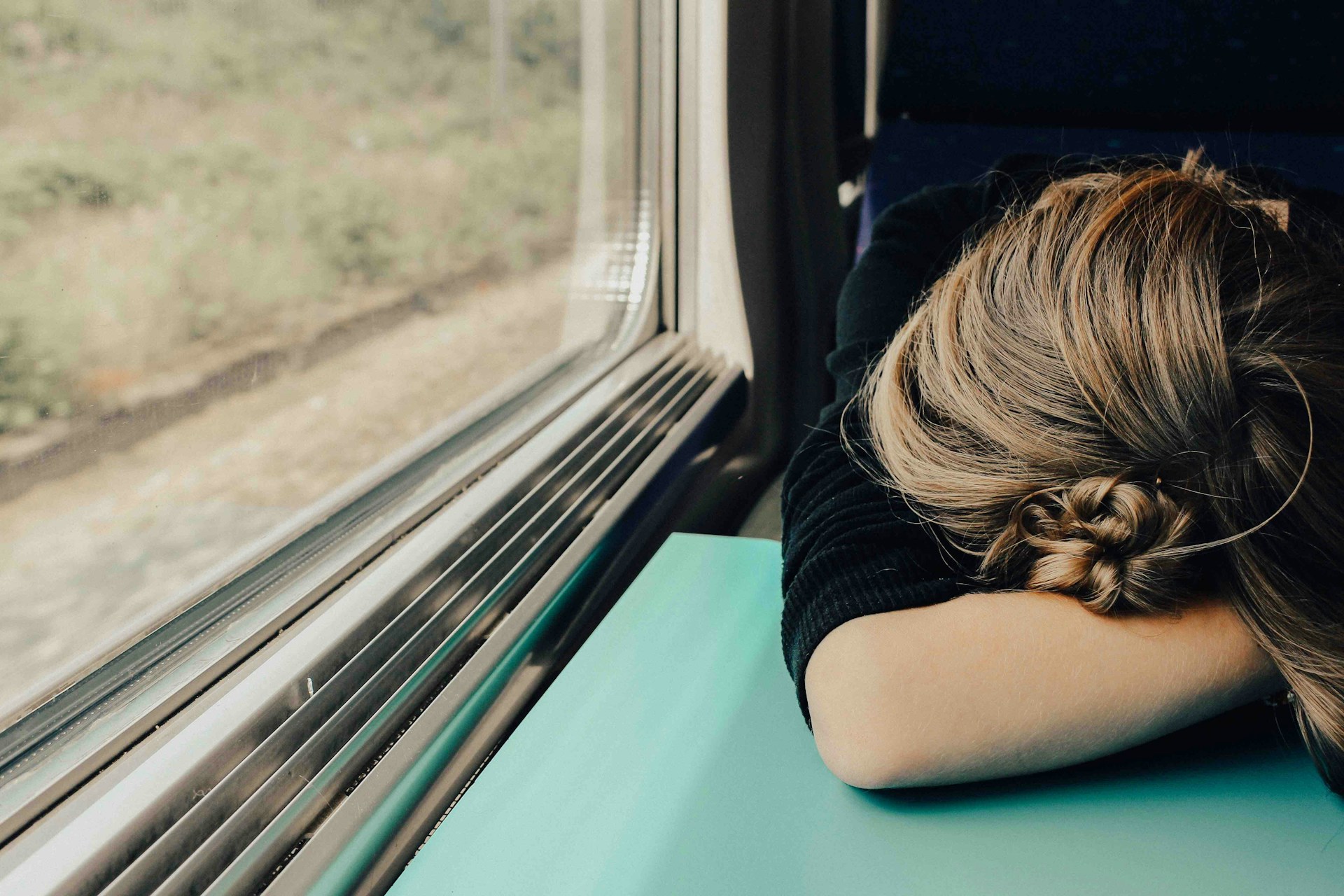 woman sleeping on a train woman sleeping on a train