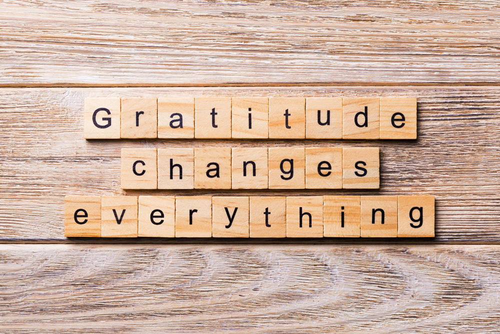 Gratitude changes everything word written on wood block. Gratitude changes everything scrabble tiles Gratitude changes everything word written on wood block. Gratitude changes everything scrabble tiles
