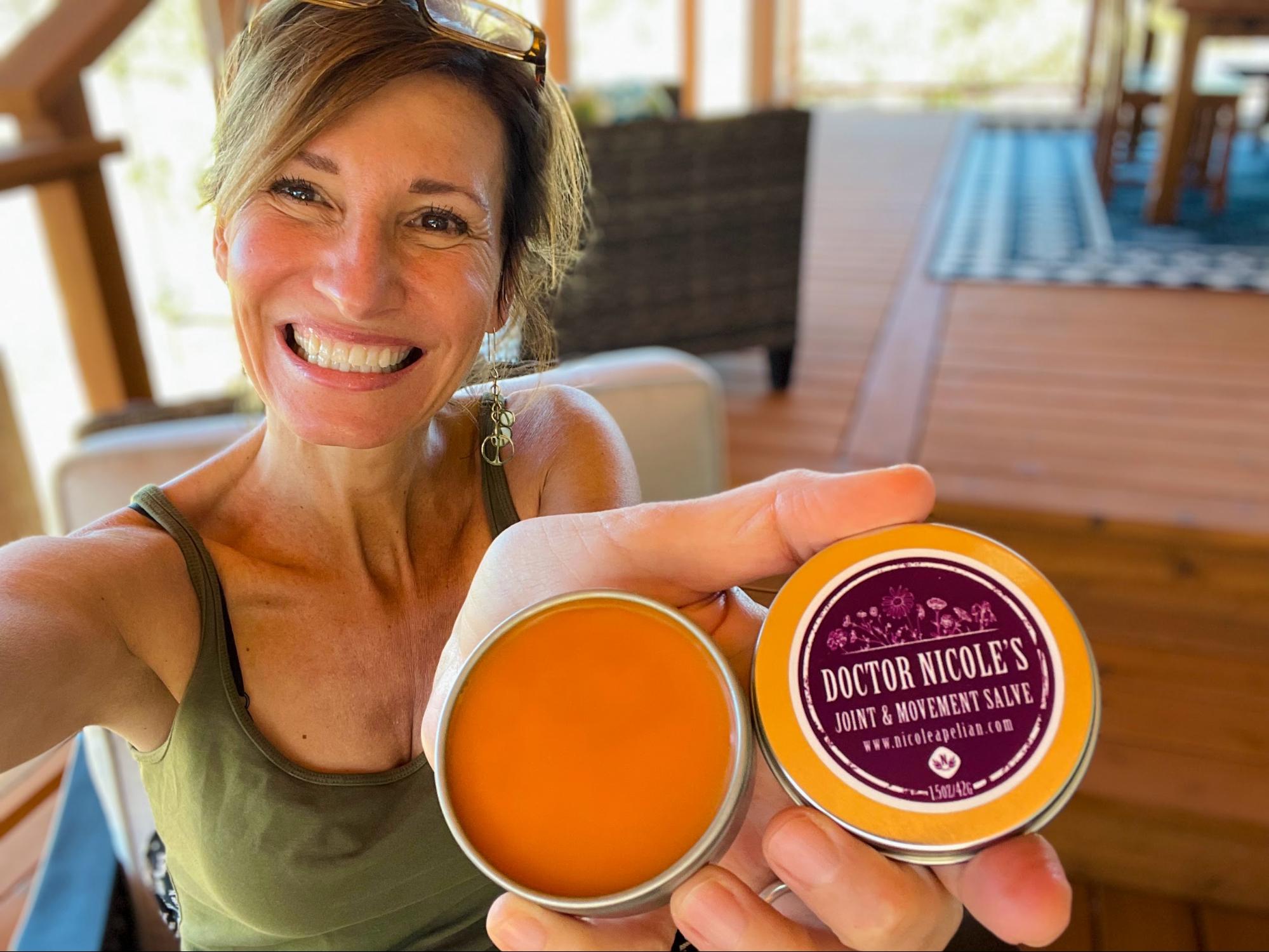 Nicole Apelian holding her Joint and Movement salve