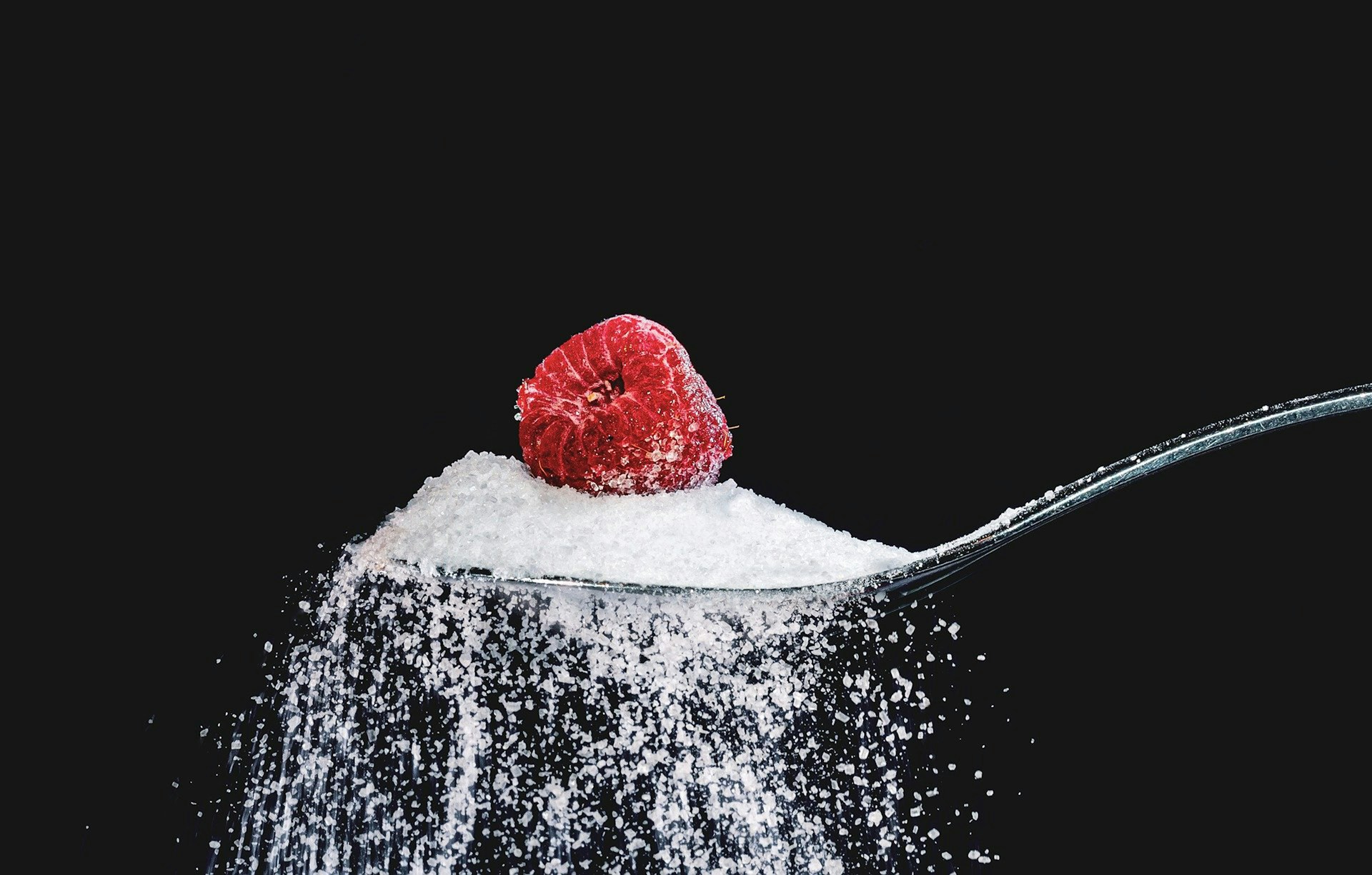 raspberry on a spoonful of sweetener raspberry on a spoonful of sweetener