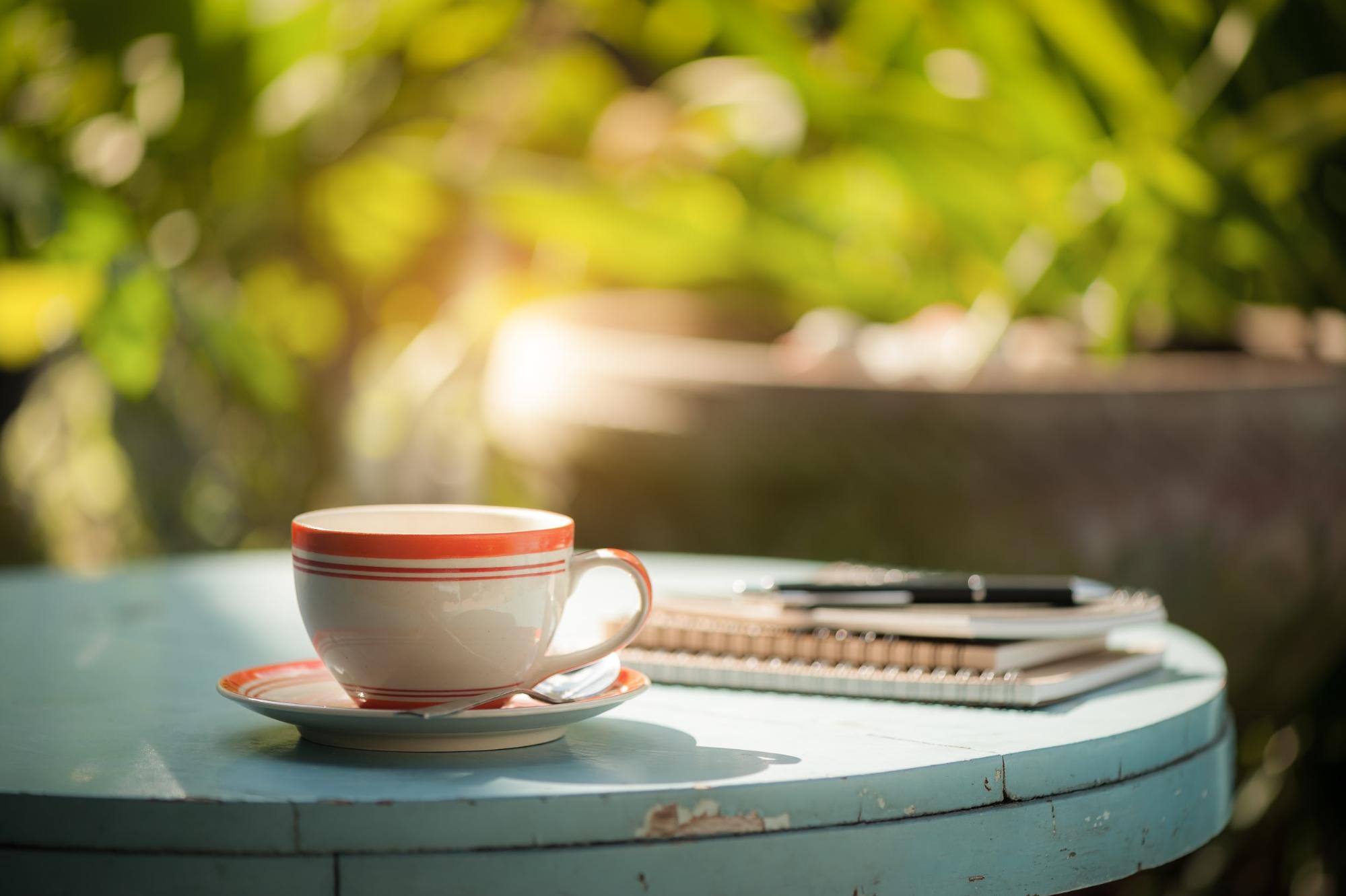 coffee cup on a table outdoors coffee cup on a table outdoors