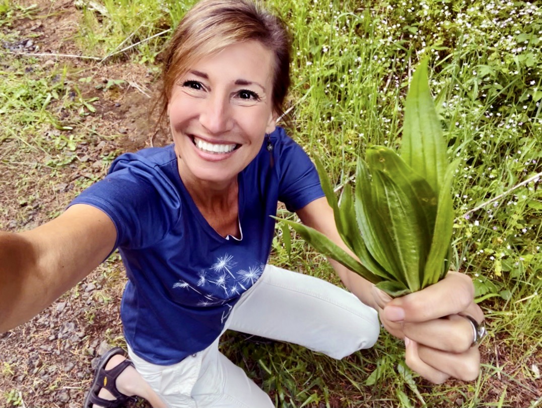 Nicole Apelian holding foraged plantago