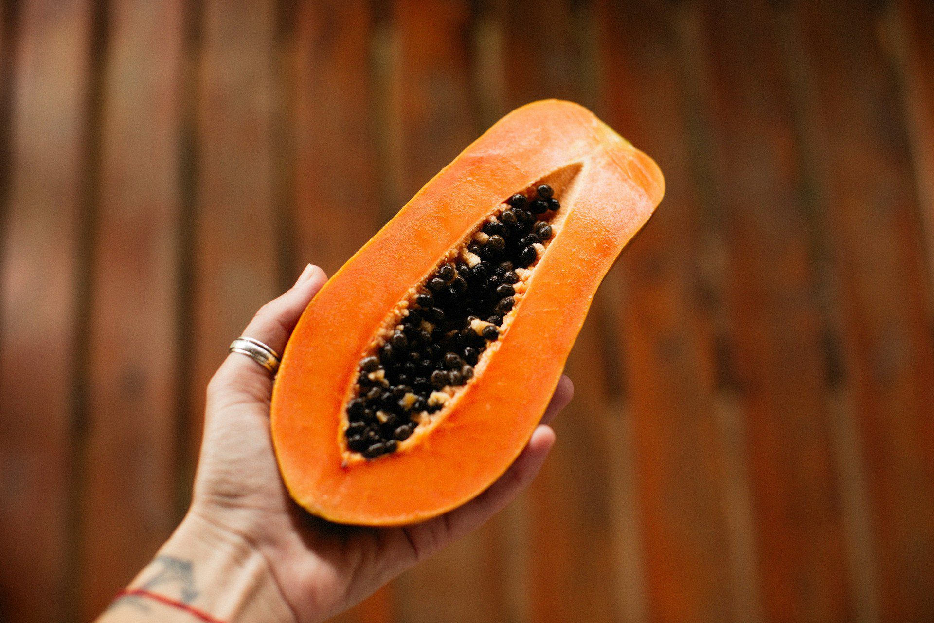 hand holding papaya