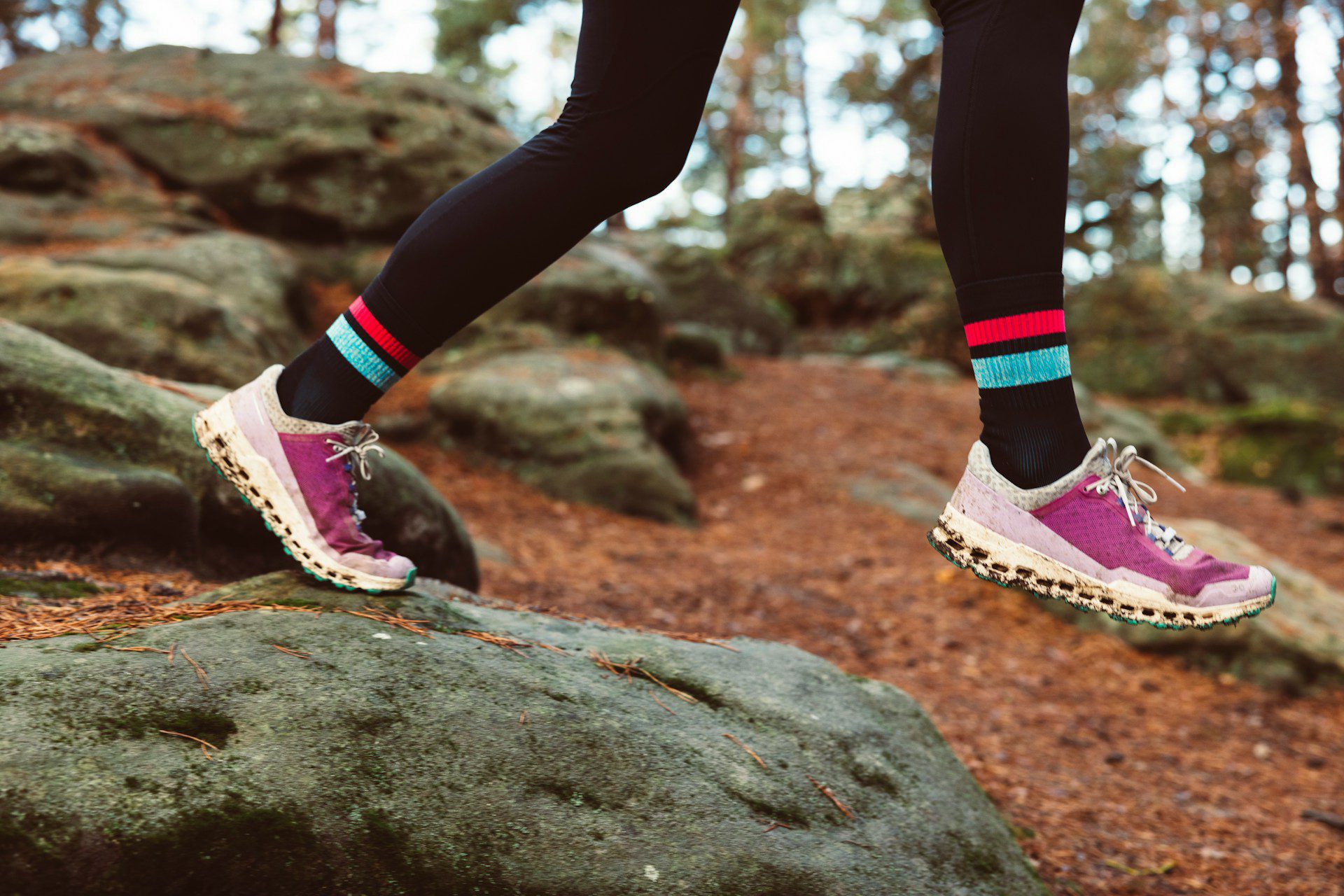 trail running in purple sneakers