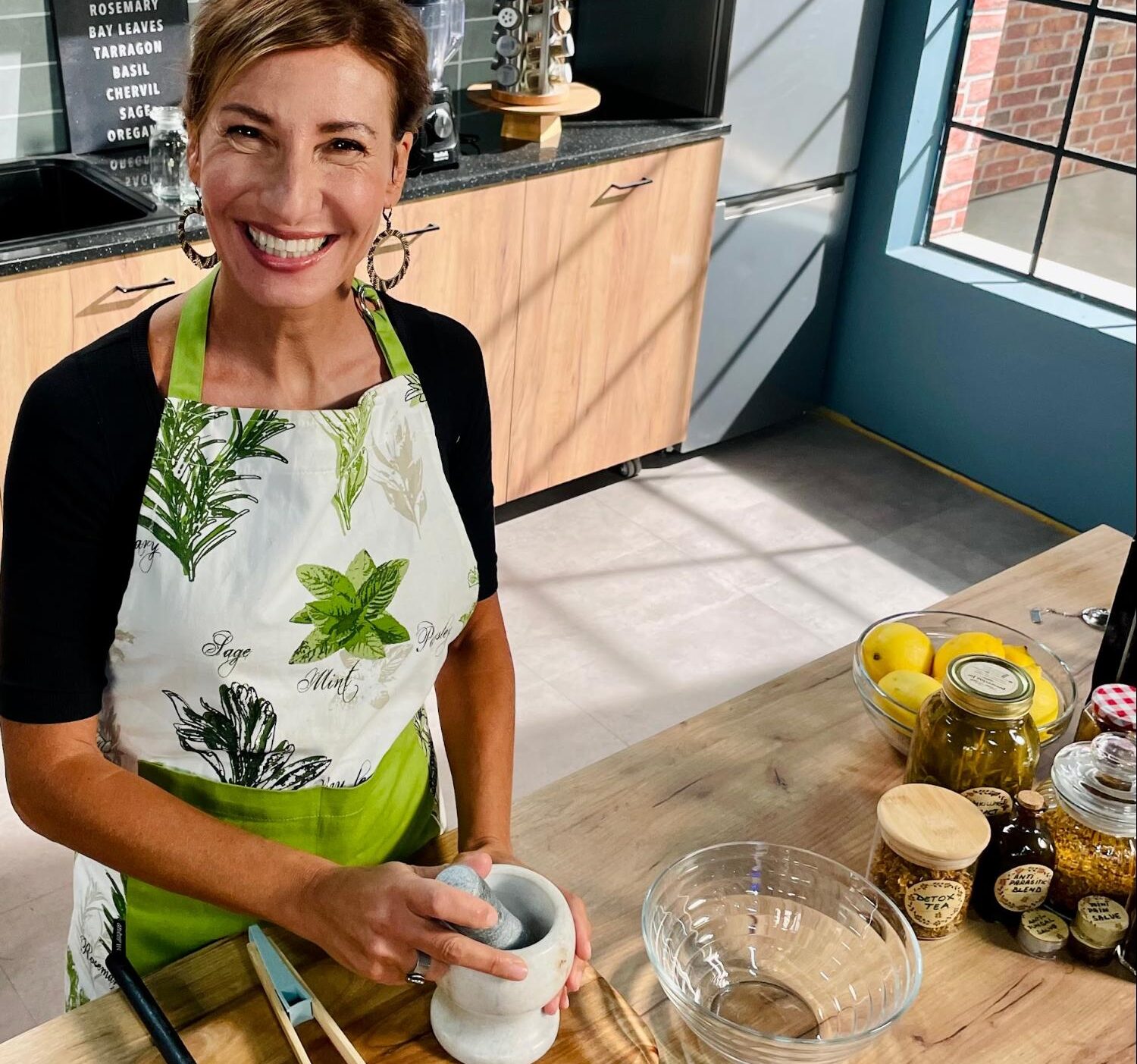 Nicole Apelian prepping herbs
