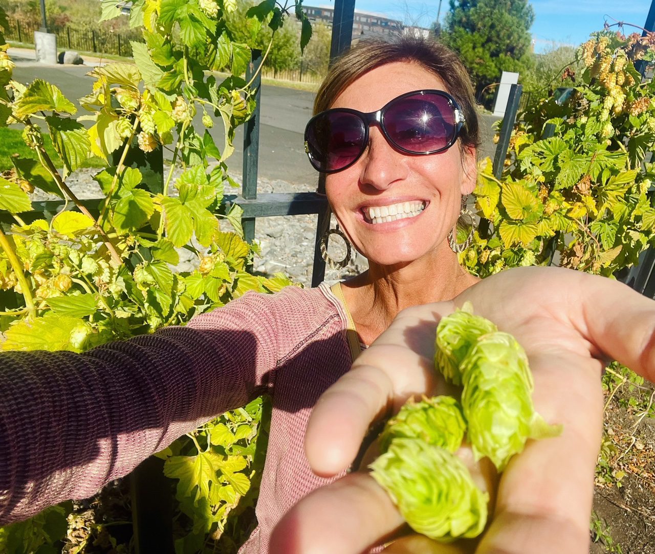Nicole Apelian holding hops How Your Diet May Be Sabotaging Your Sleep (And What to Eat Instead)