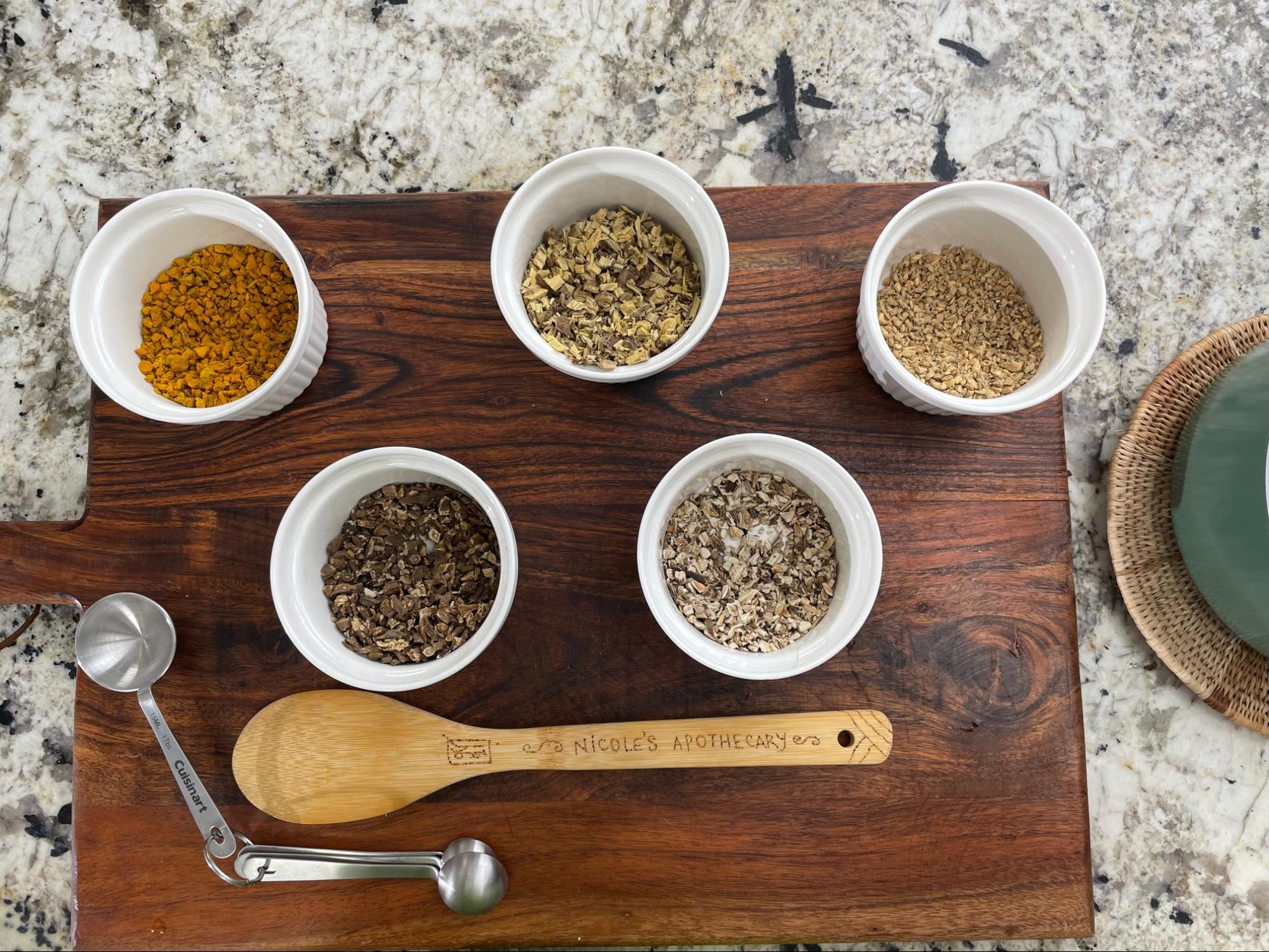 dried herbs in bowls dried herbs in bowls
