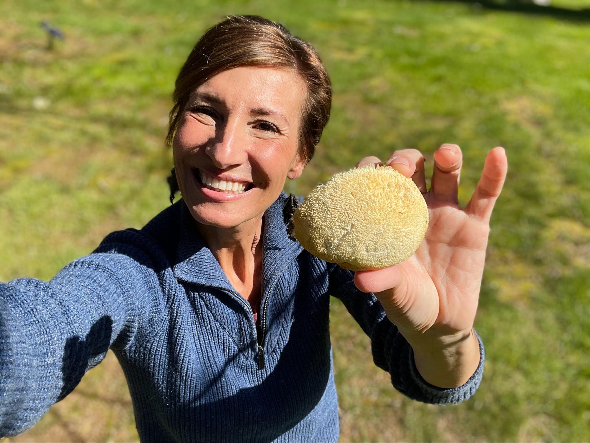 Nicole Apelian holding lions mane mushroom